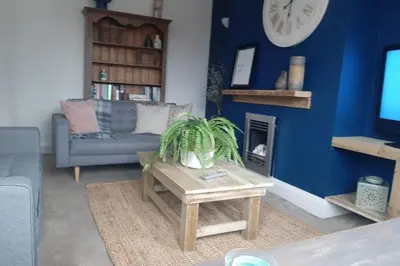 a living room with a couch and a table at Unique 2 Bedroom Apartment in the Ideal Location in Blackpool