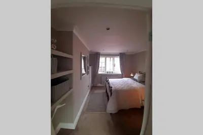 a bedroom with a bed and a window at Unique 2 Bedroom Apartment in the Ideal Location in Blackpool