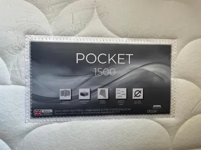 a box of rockett on a bed at Dinorwic Lodge in Liverpool