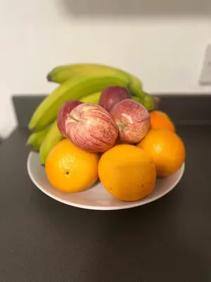 a plate of fruits and vegetables on a table at Dinorwic Lodge in Liverpool