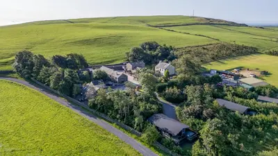 an aerial view of a house in a field at Laithe Cottage in Ulverston