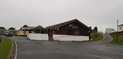 a wooden building on the side of a road at Port Haverigg Marina Village in Millom