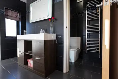 a bathroom with a sink and a toilet at Finest Retreats - Walney Island Lighthouse in Rampside