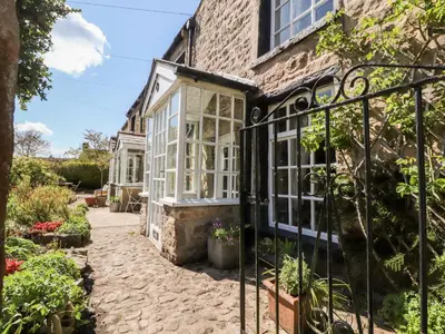 an external view of a house with a garden at Sunny Bank in Lancaster