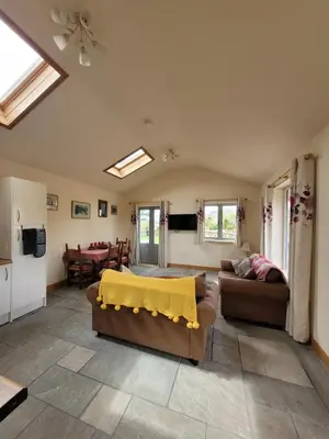 a living room with a couch and a table at Swallow cottage, Over Kellet in Over Kellet