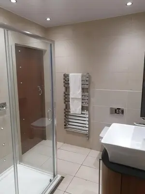 a bathroom with a shower and a sink at Infinity PartyPadsLiverpool Hen and Stag Welcome in Liverpool