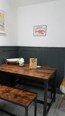 a wooden table with a sign on top of it at Families Only - Pet Friendly sleeps 6 maximum NO PARTIES in Blackpool