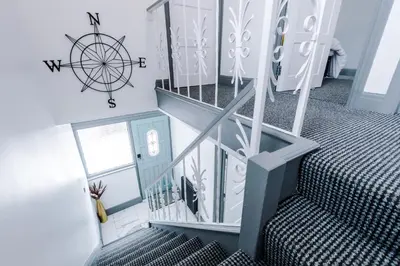 a set of stairs with a wheel on the wall at Families Only - Pet Friendly sleeps 6 maximum NO PARTIES in Blackpool