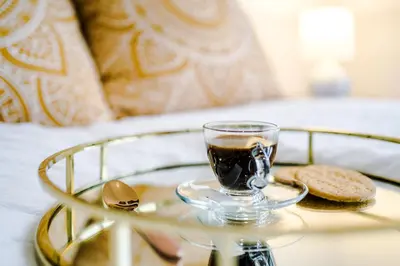 a glass cup of coffee on a glass table at Families Only - Pet Friendly sleeps 6 maximum NO PARTIES in Blackpool