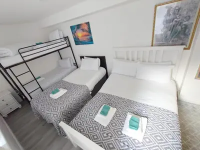 two beds in a small room with at High Tide Hotel Oyo in Blackpool
