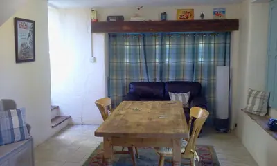 a living room with a wooden table and a couch at Cottage - Sleeps 4 - Pets Ok - Garden - Parking in Carnforth