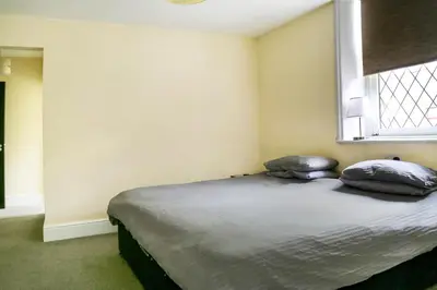 a bed in a room with two pillows on it at OYO Castle Hotel, Accrington in Accrington