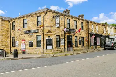 a large brick building on the side of a street at OYO Castle Hotel, Accrington in Accrington