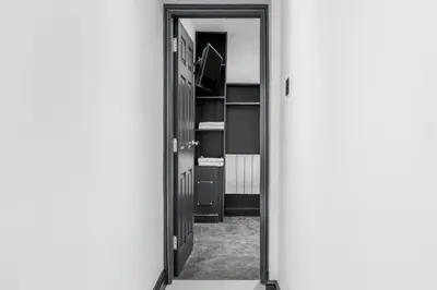 an open door leading to a room with shelves at Winter Garden Apartments by Sasco in Blackpool