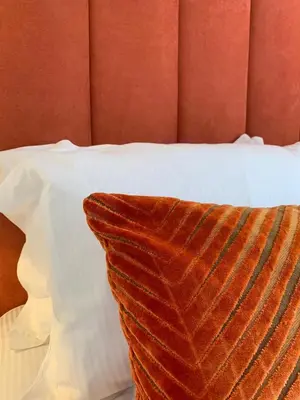 a pillow sitting on top of a bed at Winckley Square Residences in Preston