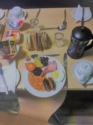 a table with a plate of breakfast food on it at The Penrhyn in Blackpool
