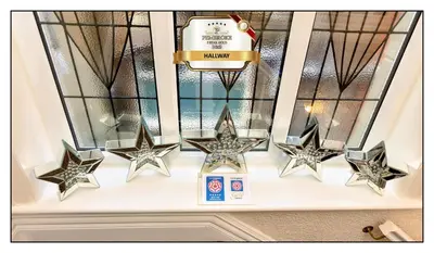 four stars on a window sill with a cake at Pembroke Hotel in Blackpool