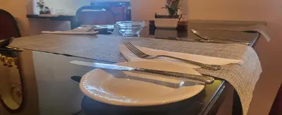 a table with a white plate and fork and knife at The Blenheim Mount Hotel in Blackpool
