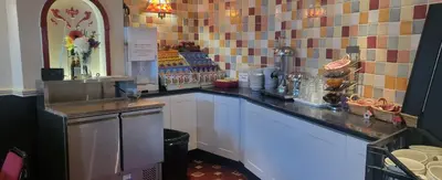 a counter in a coffee shop with a counter sidx sidx sidx at The Blenheim Mount Hotel in Blackpool