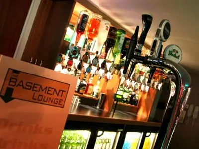 a bar with a sign in front of a bar at Dutchman Hotel in Blackpool
