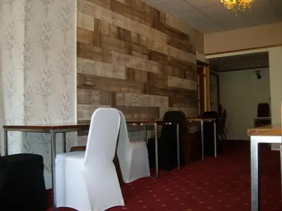 a conference room with a table and white chairs at Vista Sol in Blackpool