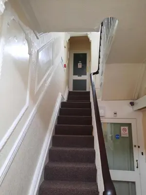 a stairway leading up to a hallway in a building at Lynwood Hotel in Blackpool