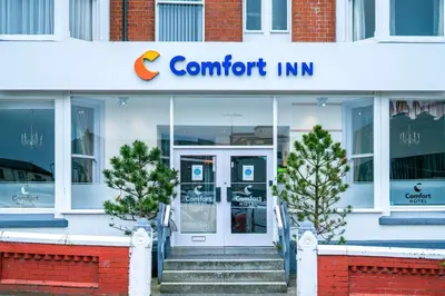 a store front with a sign for a comfort inn at Comfort Inn Blackpool Gresham in Blackpool