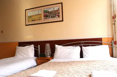 two beds sitting next to each other in a bedroom at Topaz Blackpool in Blackpool