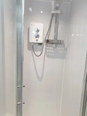 a bathroom with a phone on the wall at Langroyd Hotel in Blackpool