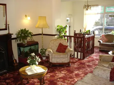 a living room with a couch and a chair at The Hollingworth in Lytham St Annes