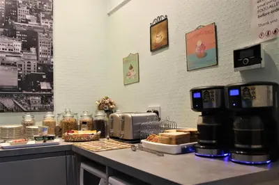 a coffee shop counter with a coffee maker on it at The Hollingworth in Lytham St Annes