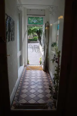 an open door to a hallway with a tile floor at The Hollingworth in Lytham St Annes