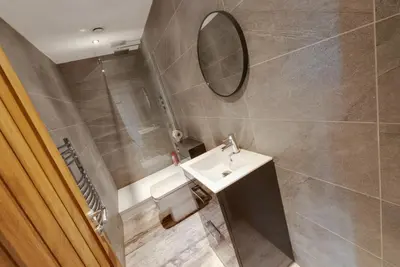 a bathroom with a sink and a mirror at Mathew Street City Centre Apartments by Happy Days in Liverpool