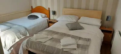 two beds in a small room with at the belvere in Blackpool