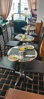 a group of tables and chairs in a restaurant at the belvere in Blackpool