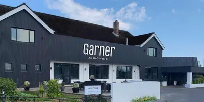 a black building with a sign that reads camera antineptic at Garner Hotel Preston Samlesbury by IHG in Preston