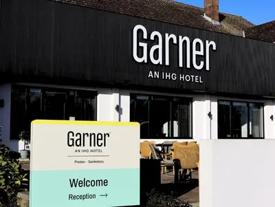 a sign in front of a building at Garner Hotel Preston Samlesbury by IHG in Preston