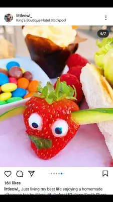 a picture of a strawberry with a face on it at Kings Boutique Hotel in Blackpool