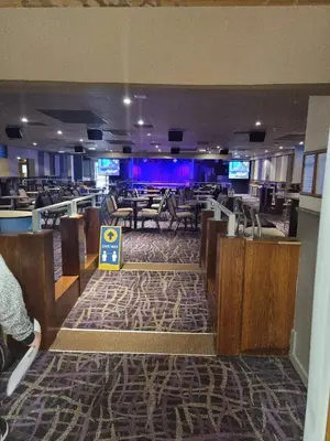 a lobby of a restaurant with tables and chairs at elbry in Heysham