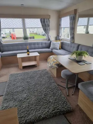 a living room with a couch and a table at elbry in Heysham