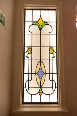 a stained glass window in a bathroom at Granada Apartments Berkeley in Blackpool