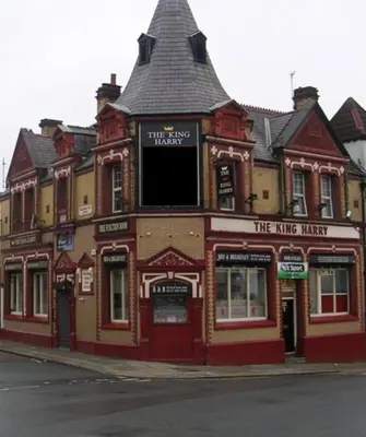 a large red building on the side of a street at Brownlows Inn Guest House formerly The King Harry Accommodation in Liverpool