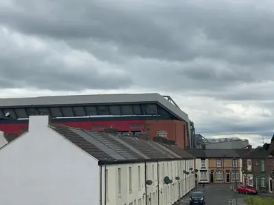 a building with a soccer stadium in the background at Brownlows Inn Guest House formerly The King Harry Accommodation in Liverpool