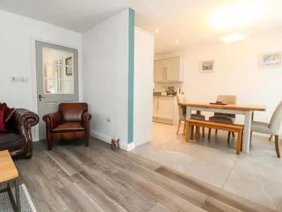 a kitchen and dining room with a table and chairs at Low Orchard House in Preston