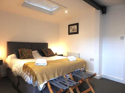 a bedroom with a bed with two towels on it at Liverpool Waterfront Stay, excellent location , parking available in Liverpool