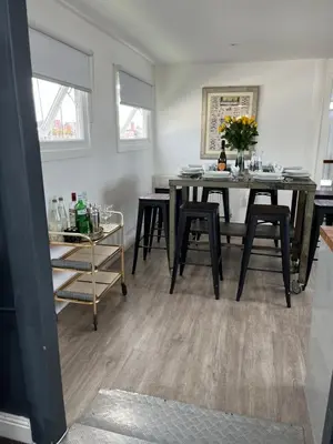 a dining room with a table and some chairs at Liverpool Waterfront Stay, excellent location , parking available in Liverpool