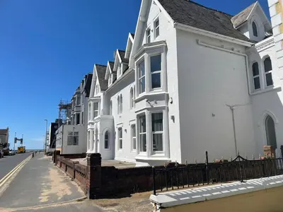 a row of white houses on the side of a street at 1820 Boutique Rooms & Suites in Blackpool
