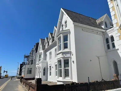 a row of white houses on a street at 1820 Boutique Rooms & Suites in Blackpool