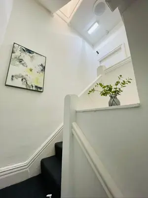 a stairway with a plant in a vase on the wall at Ivy Apartments by CityNest in Blackpool