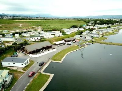 an aerial view of a small town next to a body of water at Vault 21 in Millom